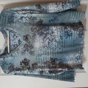 V neck top with rhinestones. Blue black and white